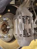 Why do my brakes click when stopping?